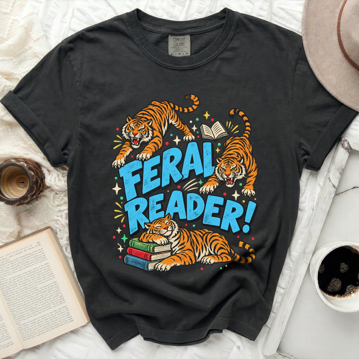 T-shirt with tigers and "Feral Reader!" text, one tiger naps on books.