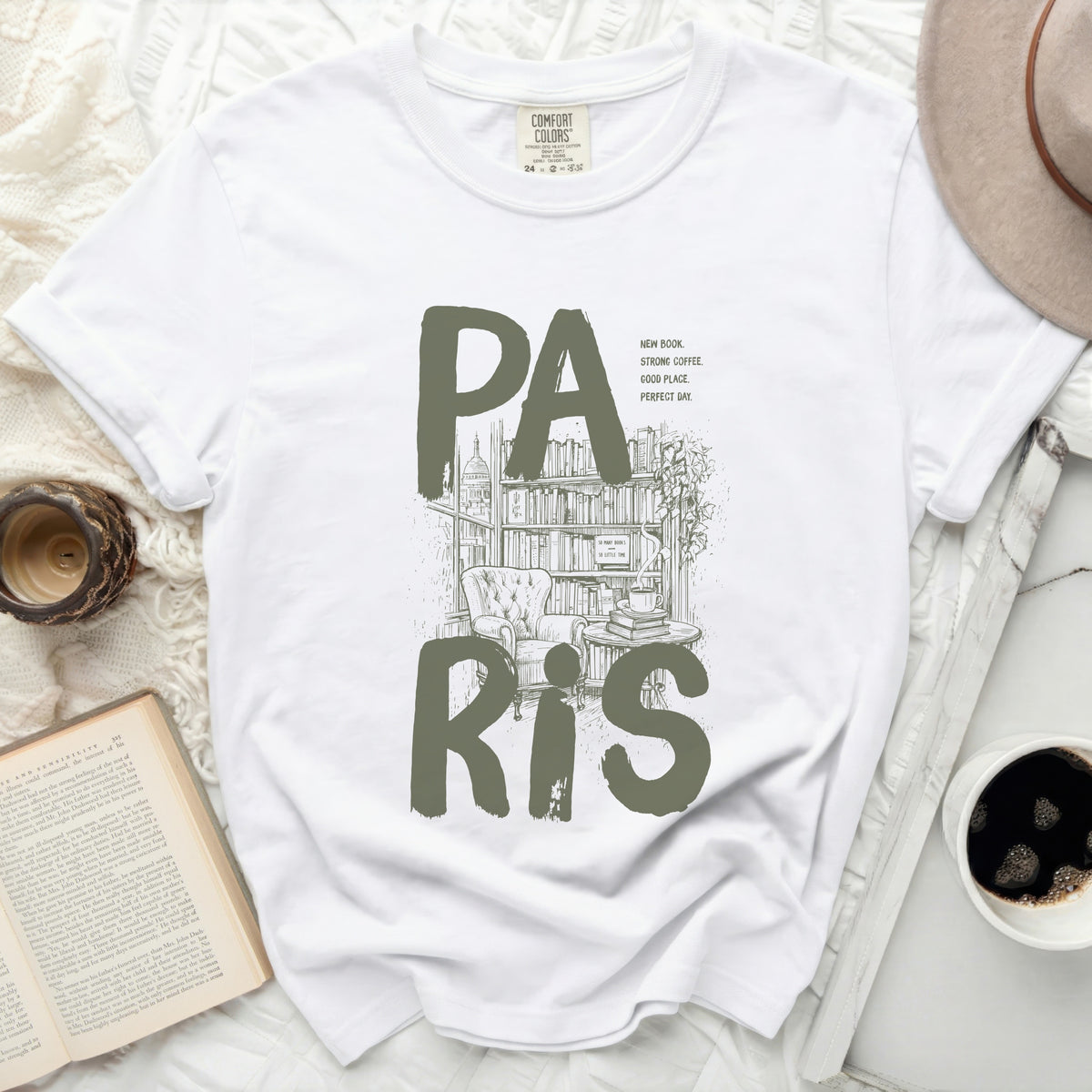 White t-shirt with "PA RIS" text, bookstore illustration, and inspirational quotes.