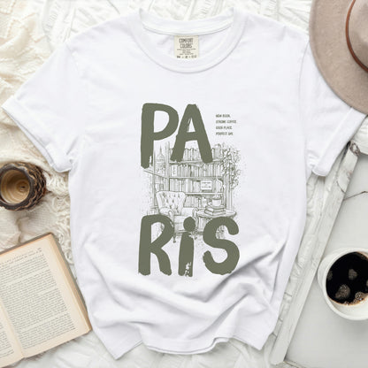 White t-shirt with "PA RIS" text, bookstore illustration, and inspirational quotes.