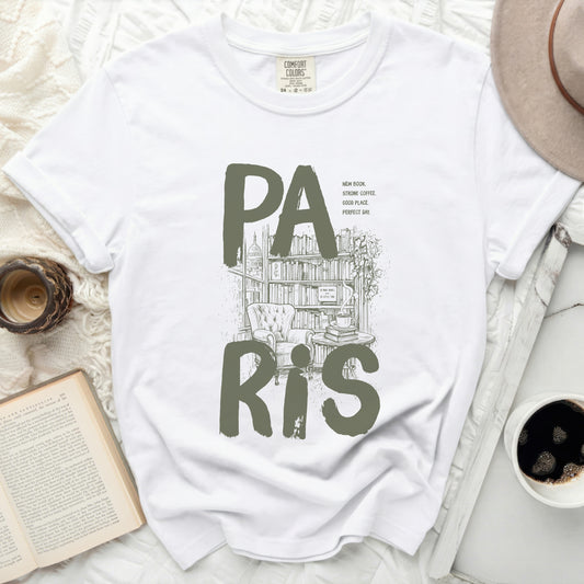 White t-shirt with "PA RIS" text, bookstore illustration, and inspirational quotes.