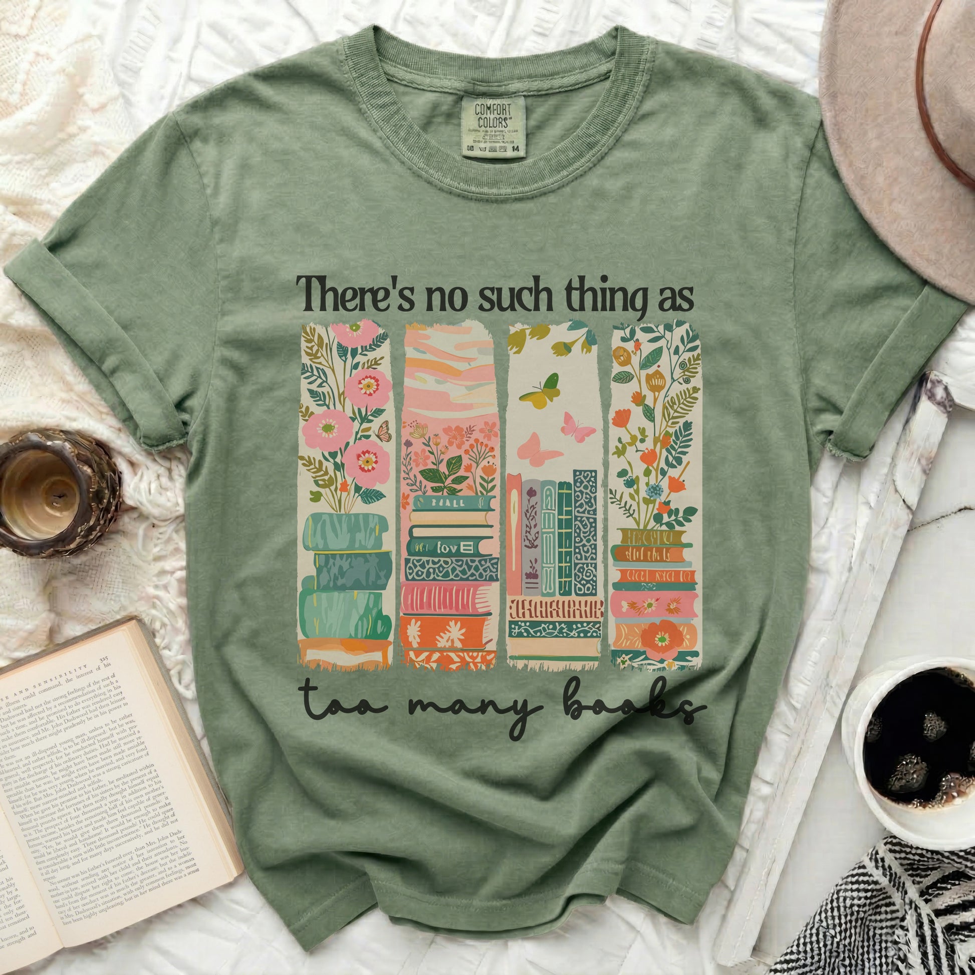 Green t-shirt with books, flowers, and "There's no such thing as too many books" text.