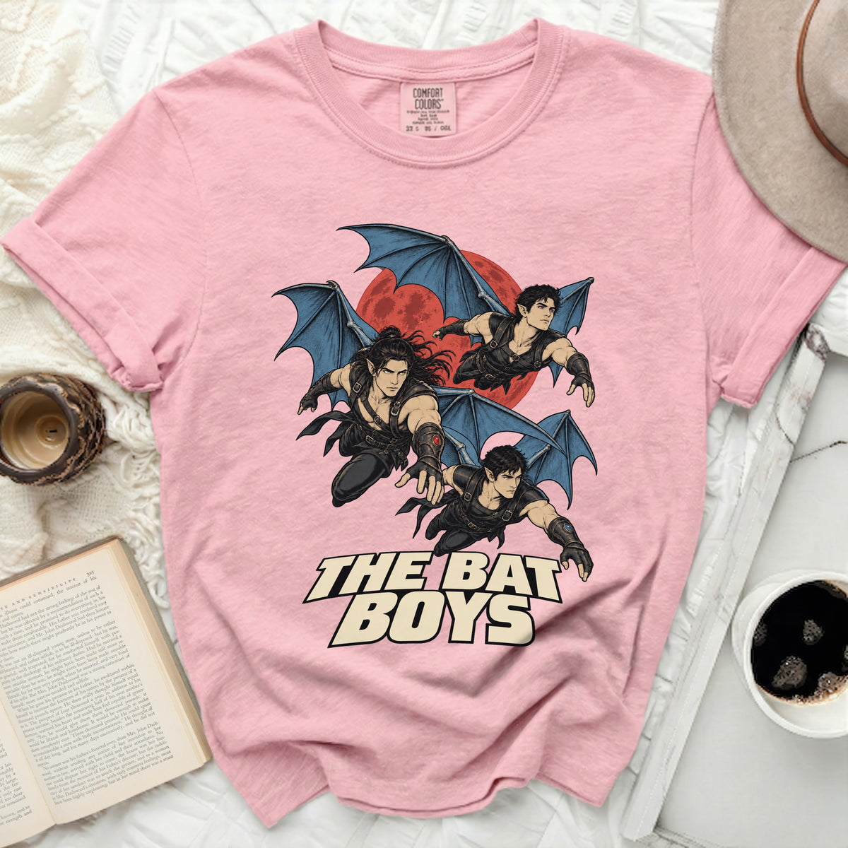 Pink t-shirt with "The Bat Boys" text and three winged figures against a red moon.