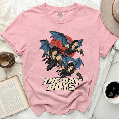 Pink t-shirt with "The Bat Boys" text and three winged figures against a red moon.