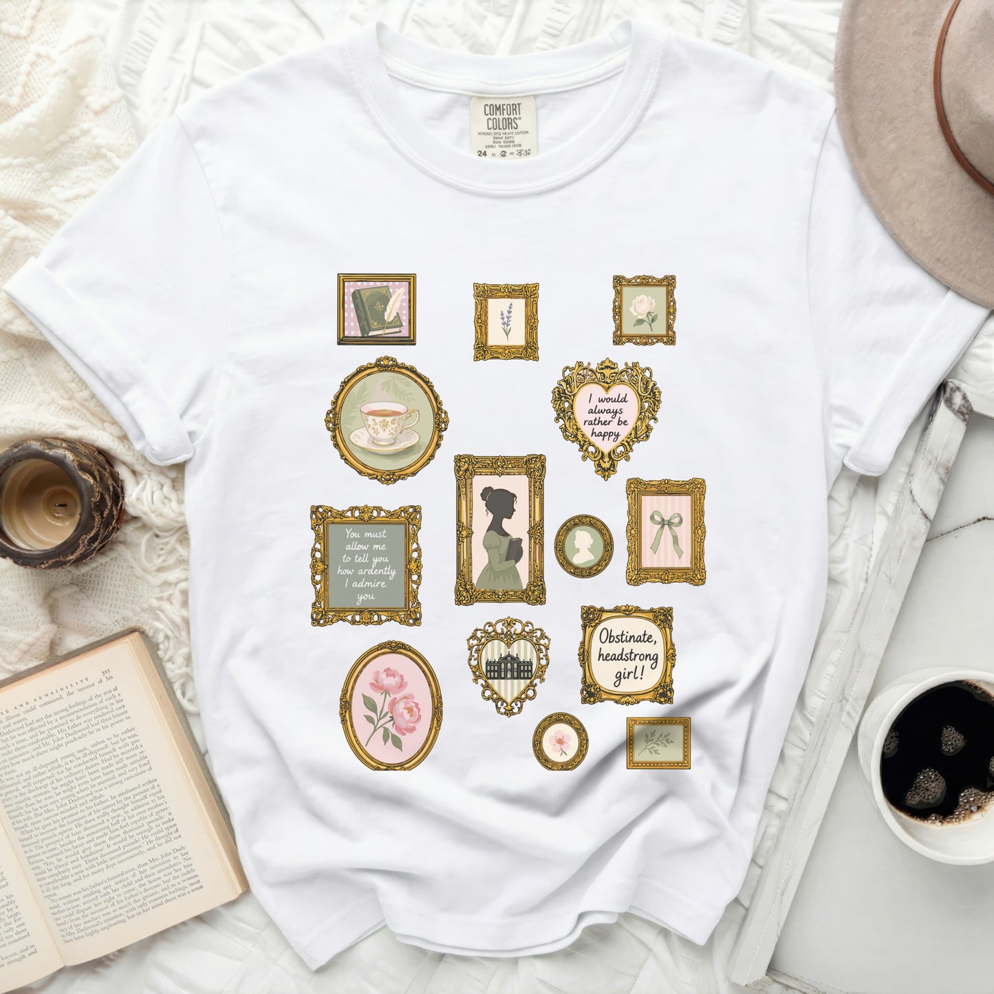 White t-shirt with vintage-style framed prints of books, tea, and quotes.