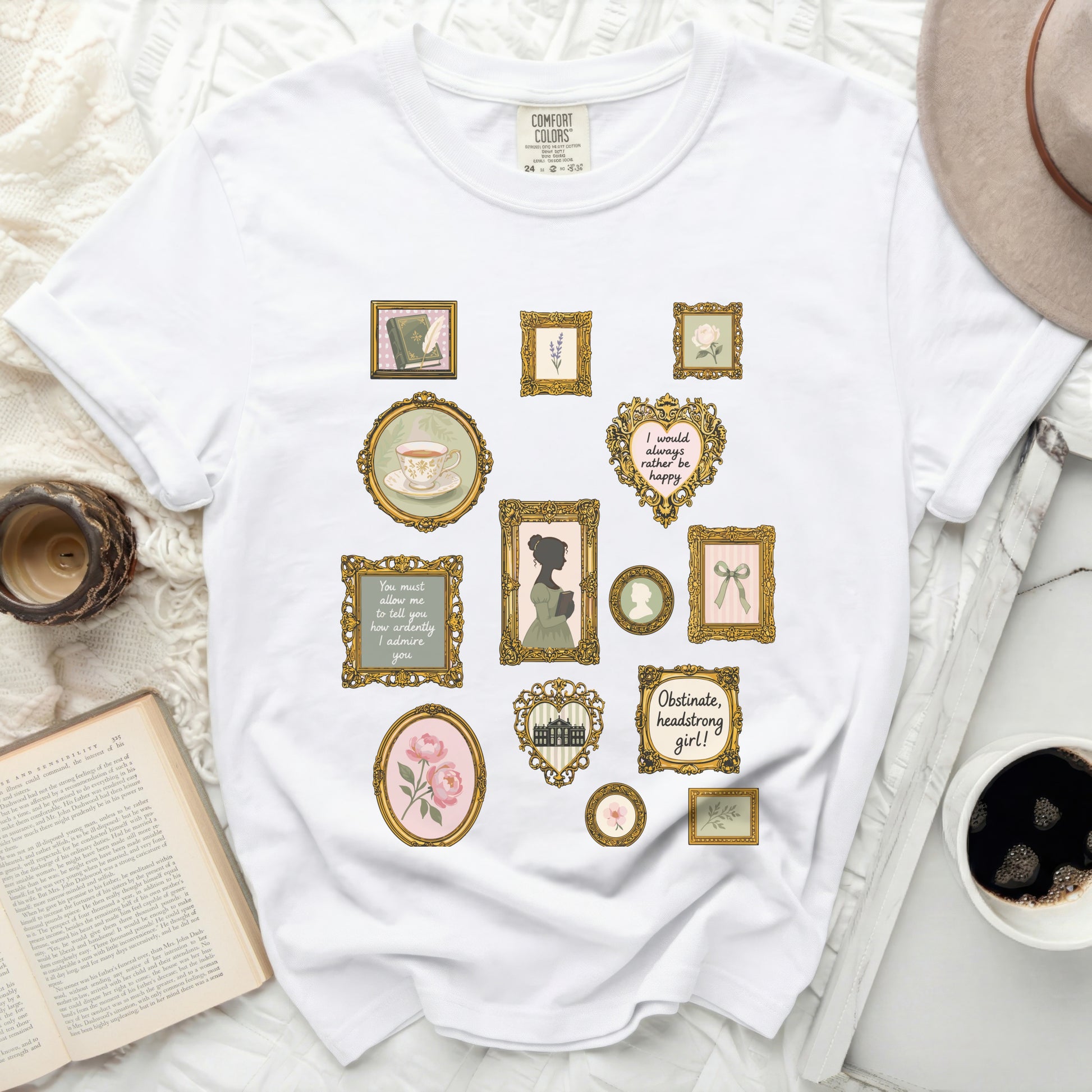 White t-shirt with vintage-style framed prints of books, tea, and quotes.