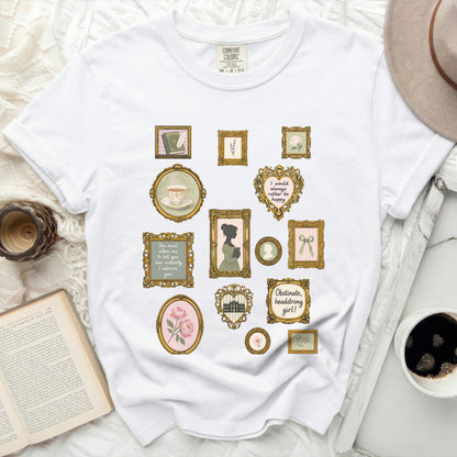 White t-shirt with vintage-style framed prints of books, tea, and quotes.