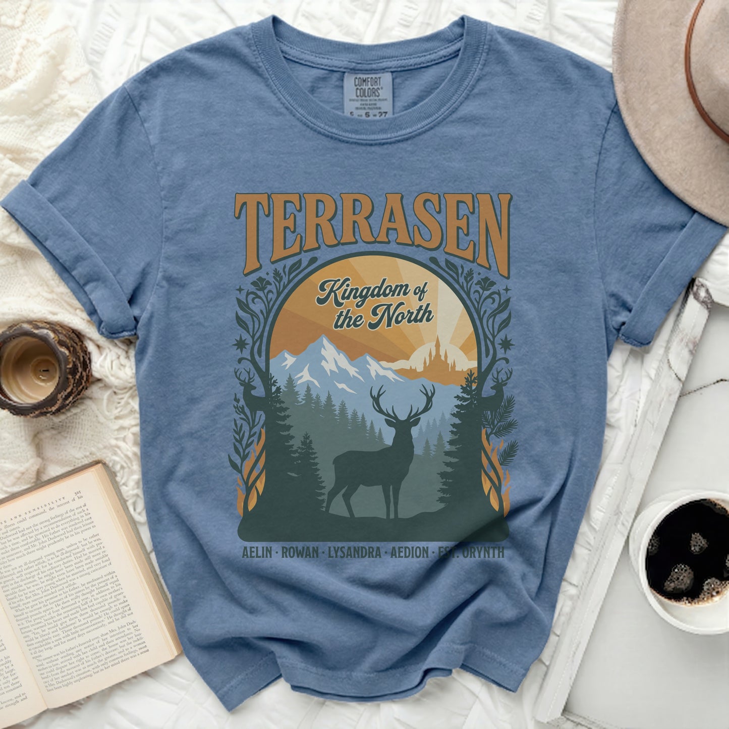 Blue t-shirt with Terrasen Kingdom of the North graphic featuring a deer.