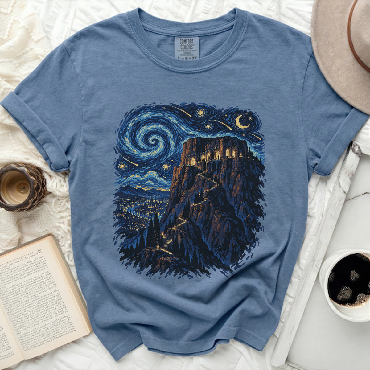 Blue t-shirt with a starry night castle and city print, size 6-27.