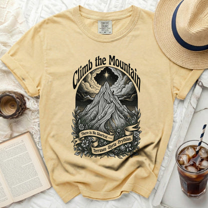 Yellow t-shirt with "Climb the Mountain" graphic, "There Is No Shortcut" banner.