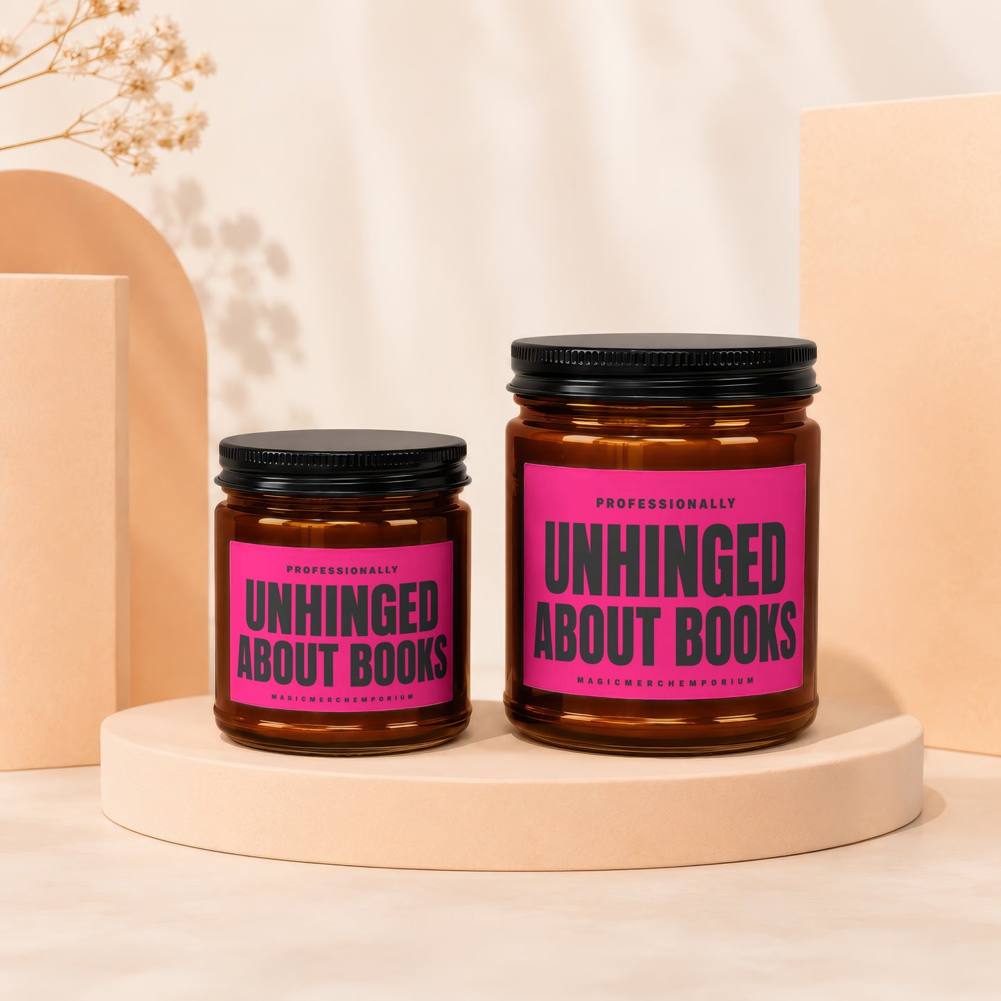 Two amber jars with black lids display pink labels reading "UNHINGED ABOUT BOOKS".