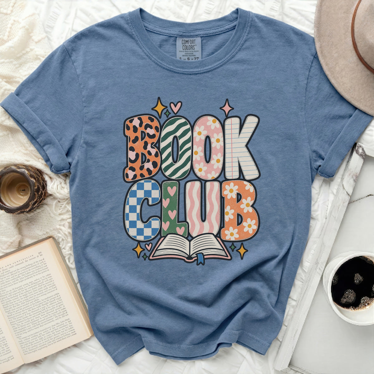 Blue t-shirt with "Book Club" text and an open book graphic.