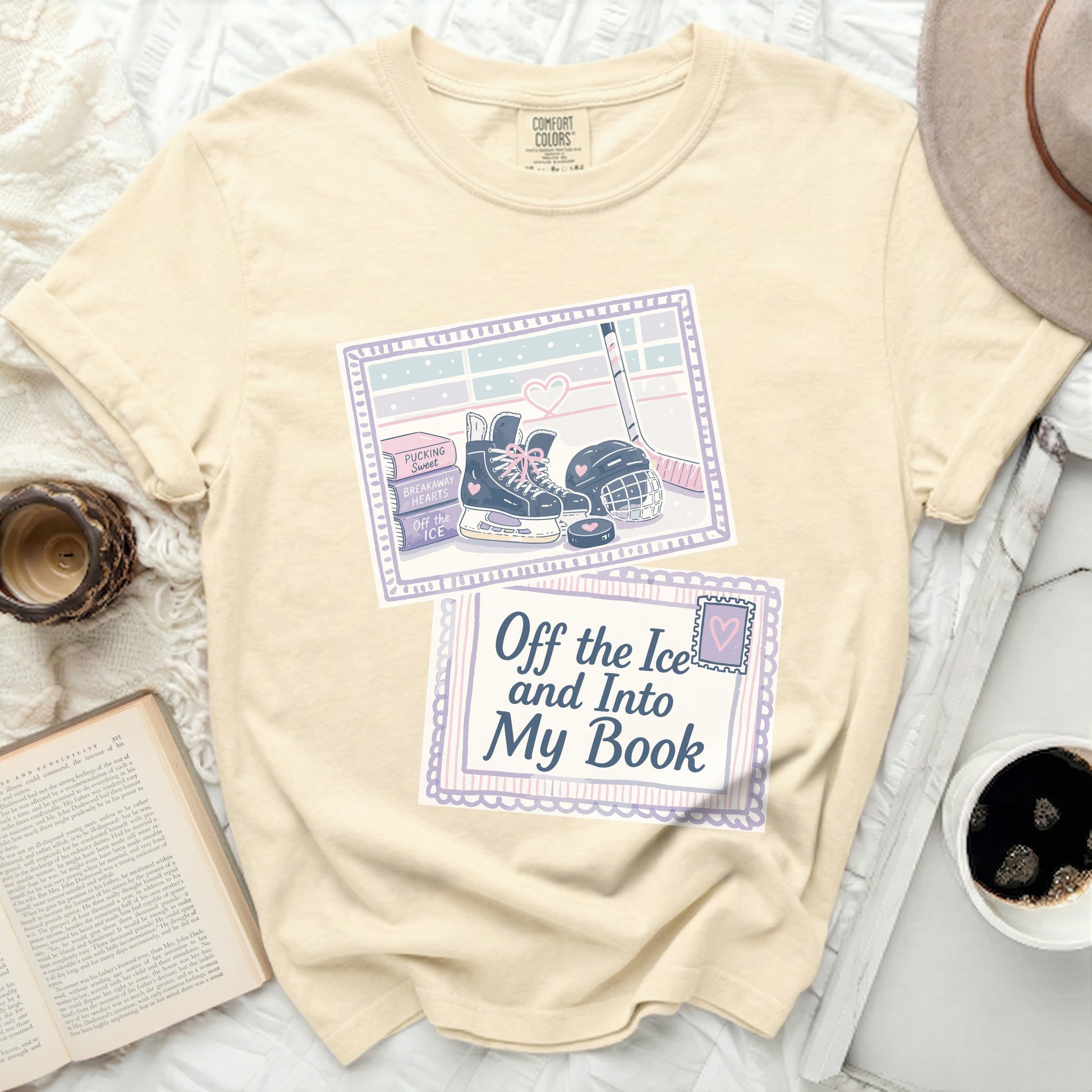 T-shirt with hockey and book graphic and "Off the Ice and Into My Book" text.