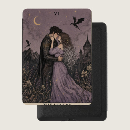 Tarot card with couple embracing, castle and dragons under starry sky, reading "THE LOVERS".