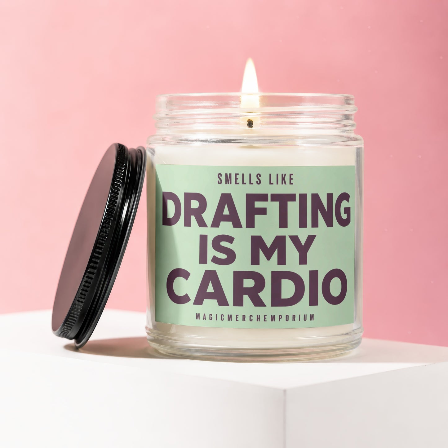 Candle with "Drafting Is My Cardio" text on a mint green label.