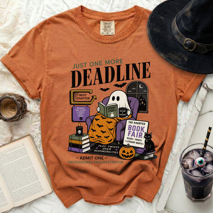 Orange t-shirt with ghost reading, "Just One More Deadline" and "Professional Procrastinator."