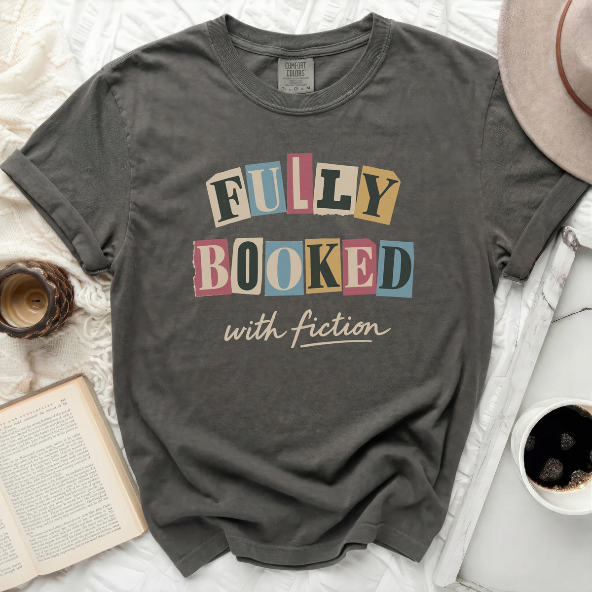 Comfort Colors t-shirt with "Fully Booked with Fiction" graphic.