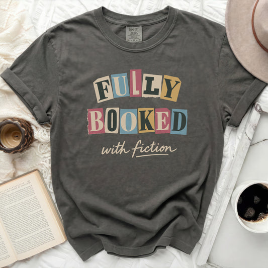 Comfort Colors t-shirt with "Fully Booked with Fiction" graphic.