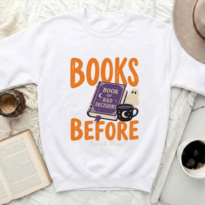 White sweatshirt with "BOOKS BEFORE Boo's & Brew" text design.