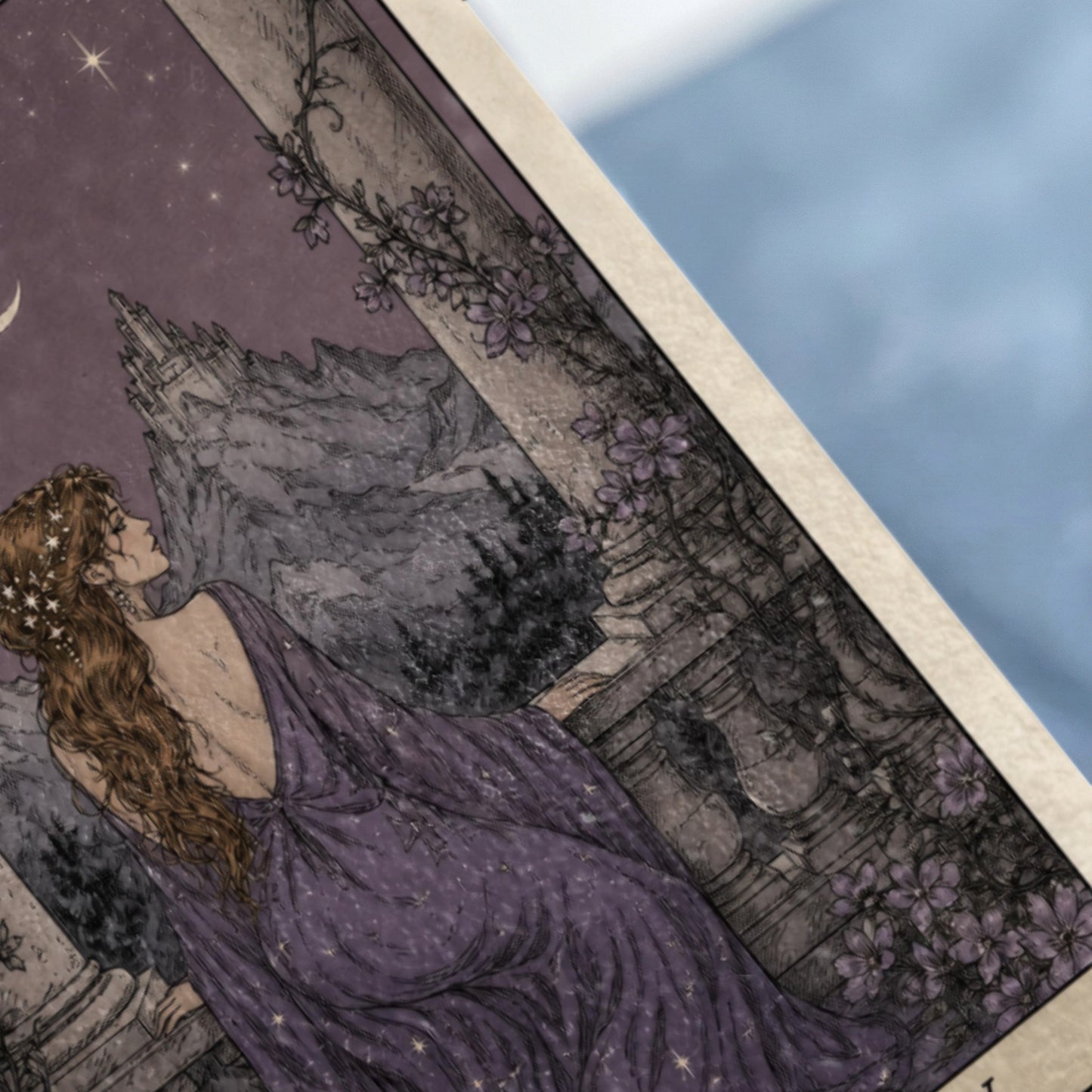 Woman in starry purple dress gazes at moonlit castle with stars and flowers.