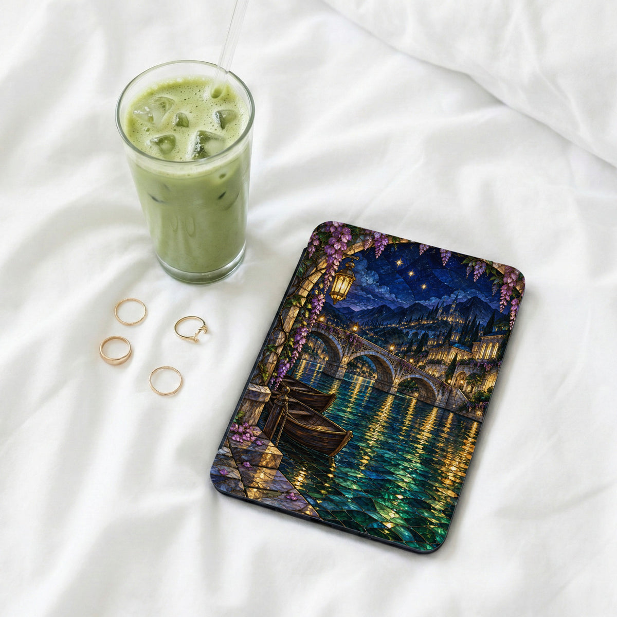 Tablet case with a stained glass bridge scene at night.
