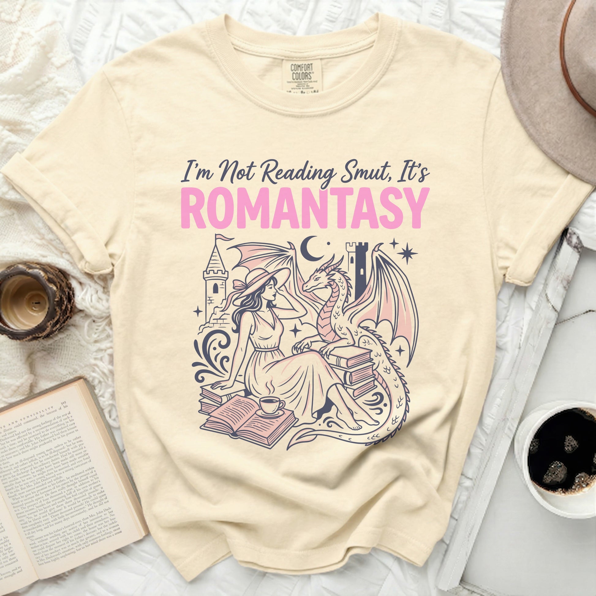 "I'm Not Reading Smut, It's ROMANTASY" text on a t-shirt with dragon and woman.