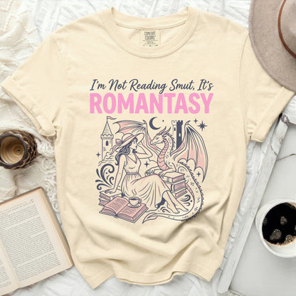 "I'm Not Reading Smut, It's ROMANTASY" text on a t-shirt with dragon and woman.