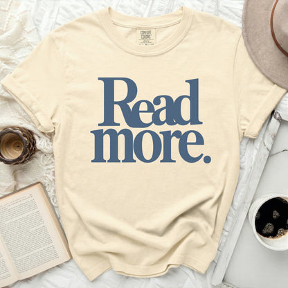 Cream t-shirt with "Read more." text in blue.