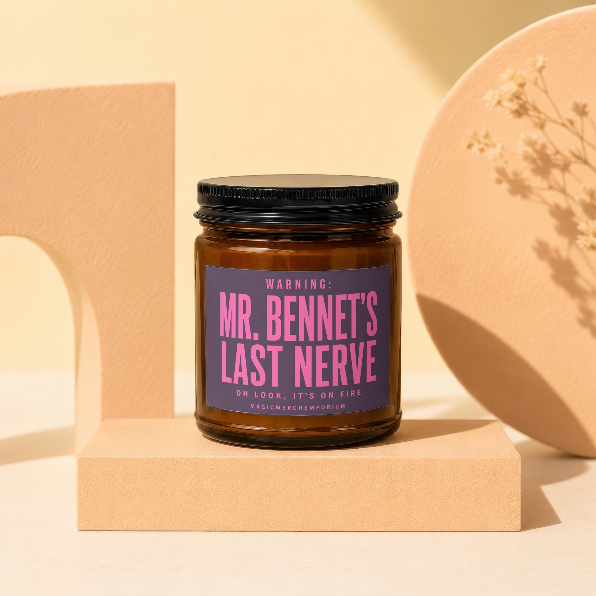 Amber jar candle with a purple label reading "Mr. Bennet's Last Nerve."