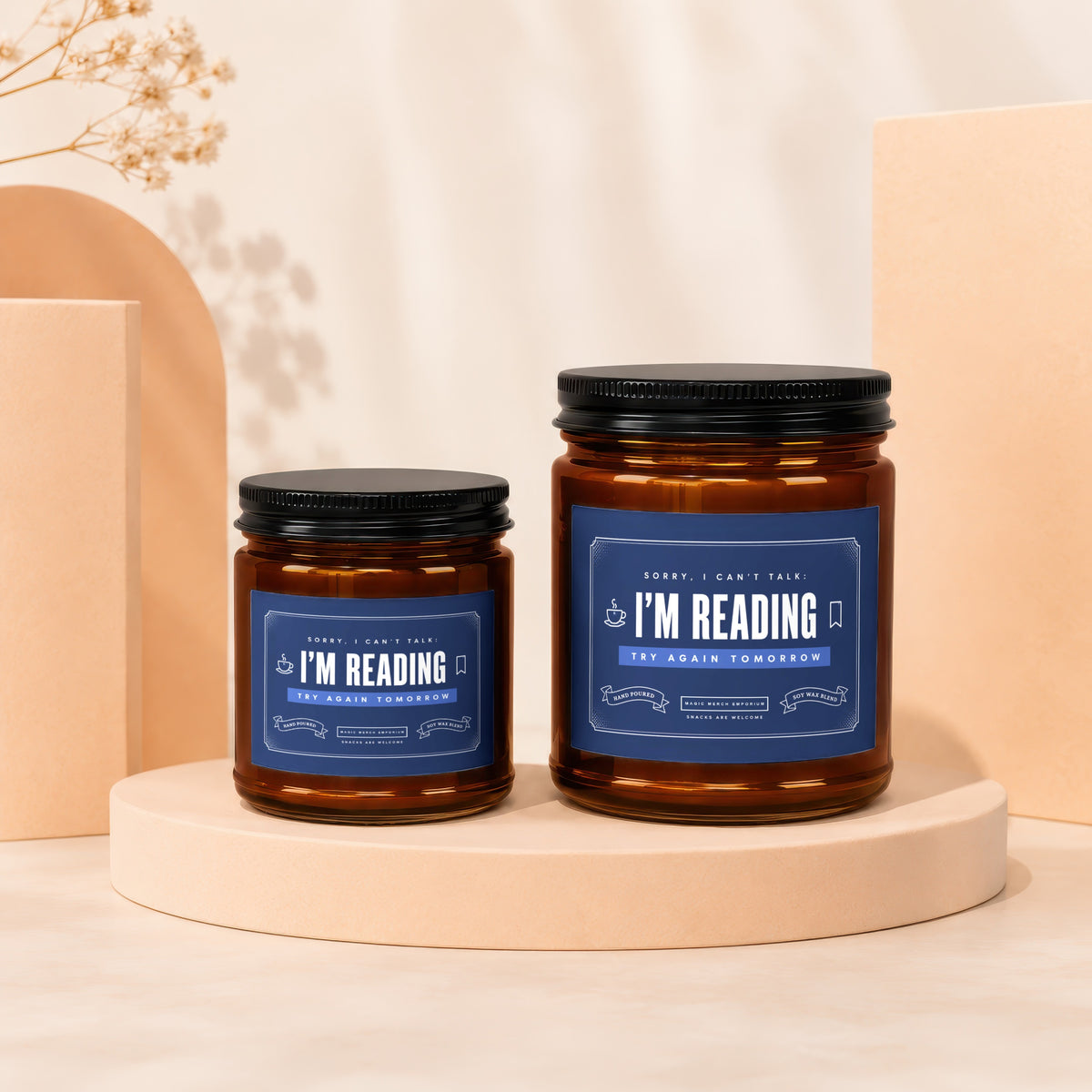 Two amber glass candles with blue labels reading "I'm Reading" and "Try Again Tomorrow".