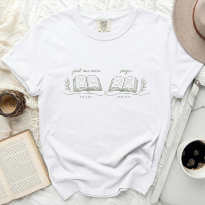 White t-shirt with "just one more page" and "BOOK CLUB EST. 2026" graphics.