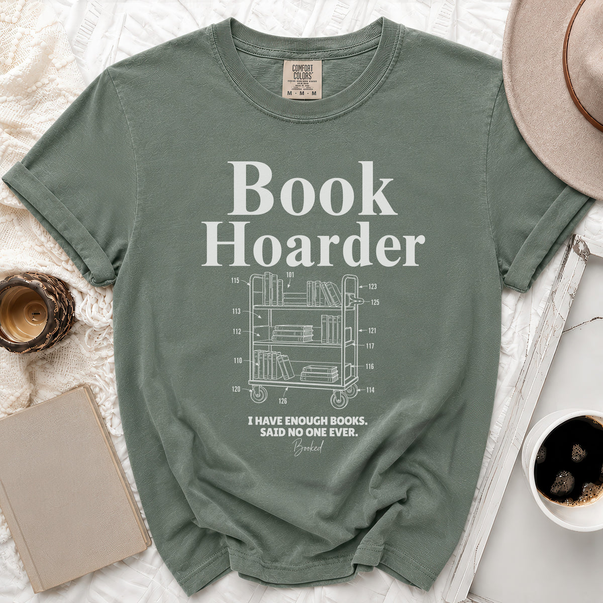 Green t-shirt with "Book Hoarder" and a bookshelf illustration.