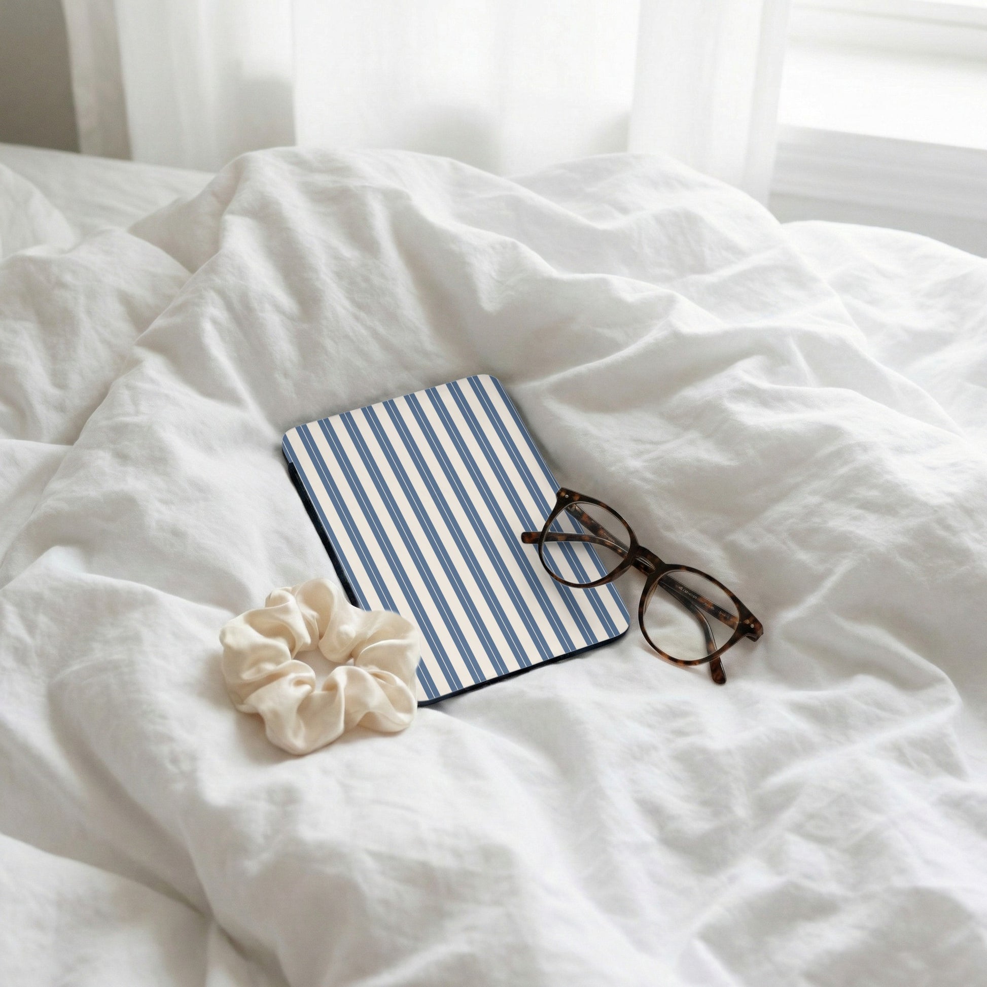 Blue and White Striped Tablet Case on Bed Linen