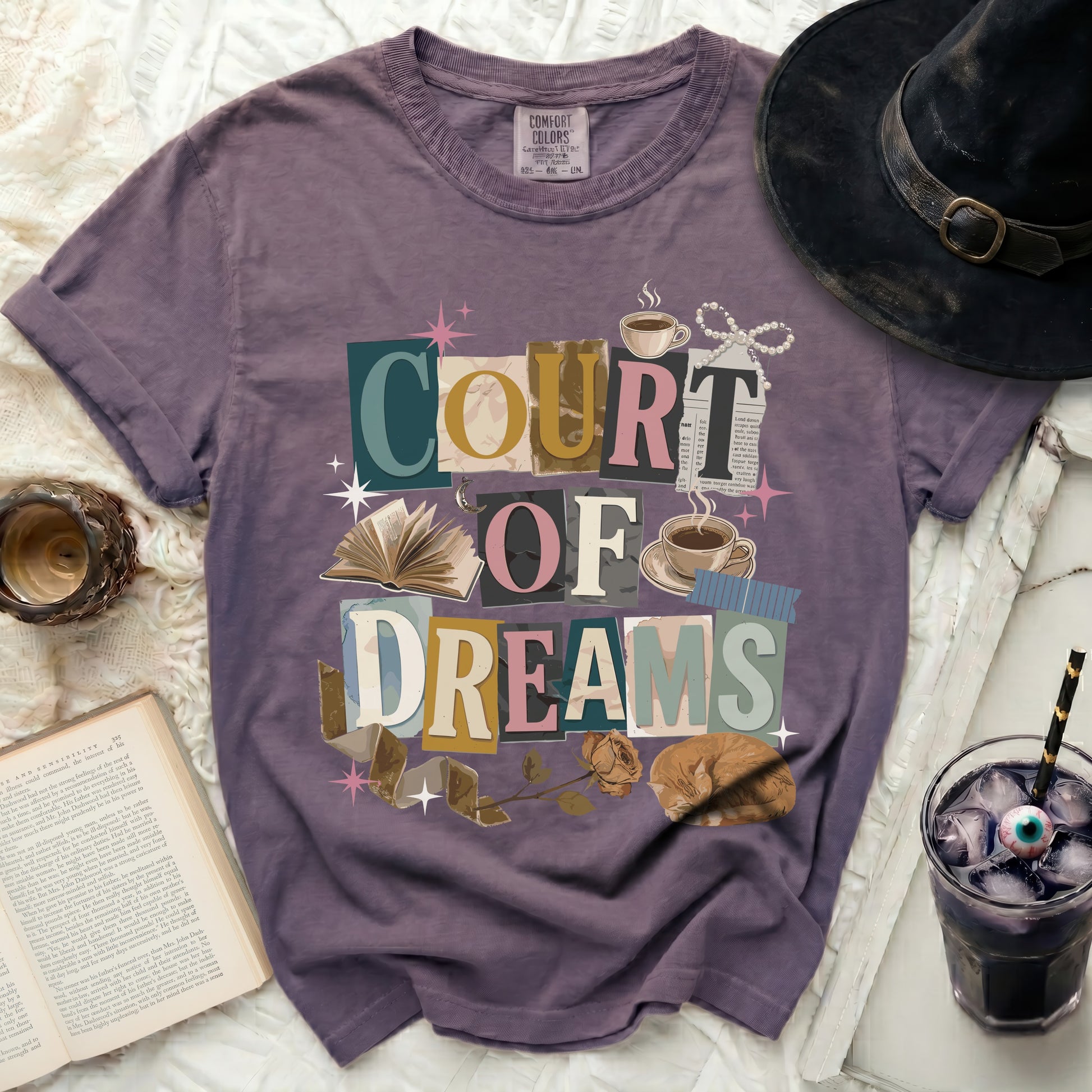 Purple t-shirt with "COURT OF DREAMS" collage graphic.