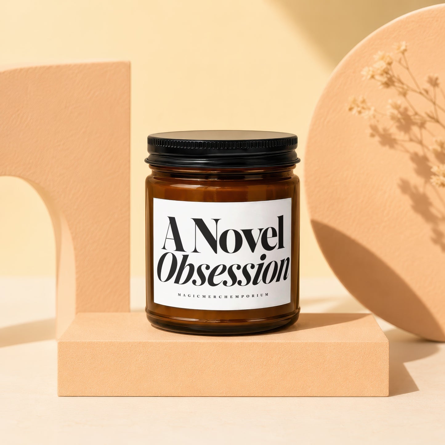 Amber jar candle labeled "A Novel Obsession" by Magic Merch Emporium.