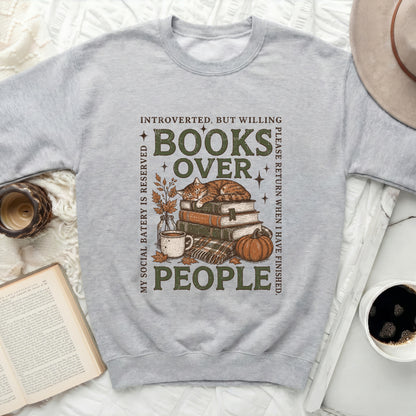 Grey sweatshirt with "Books Over People" text and a cat sleeping on books.