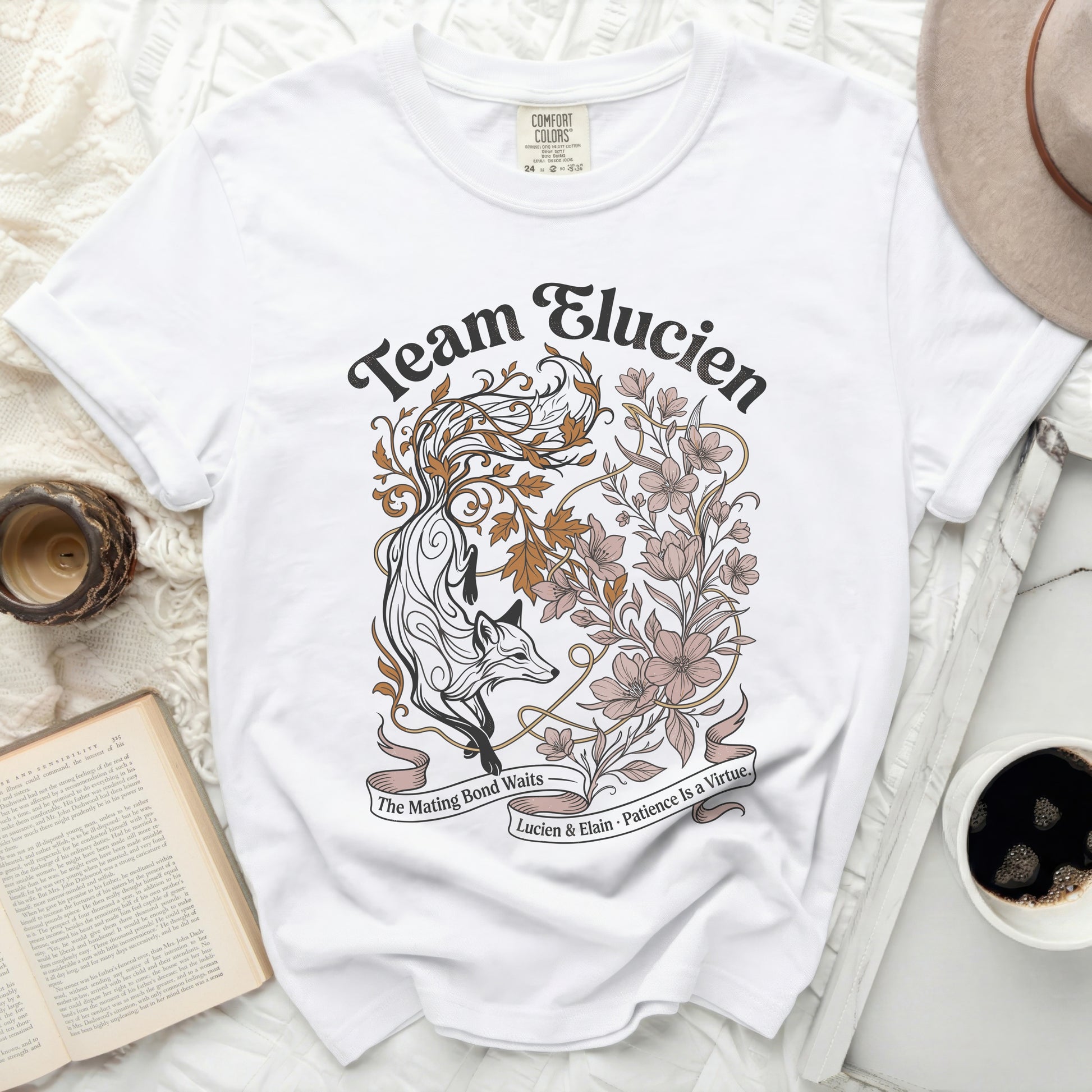 White t-shirt with "Team Elucien" and a fox with floral design.