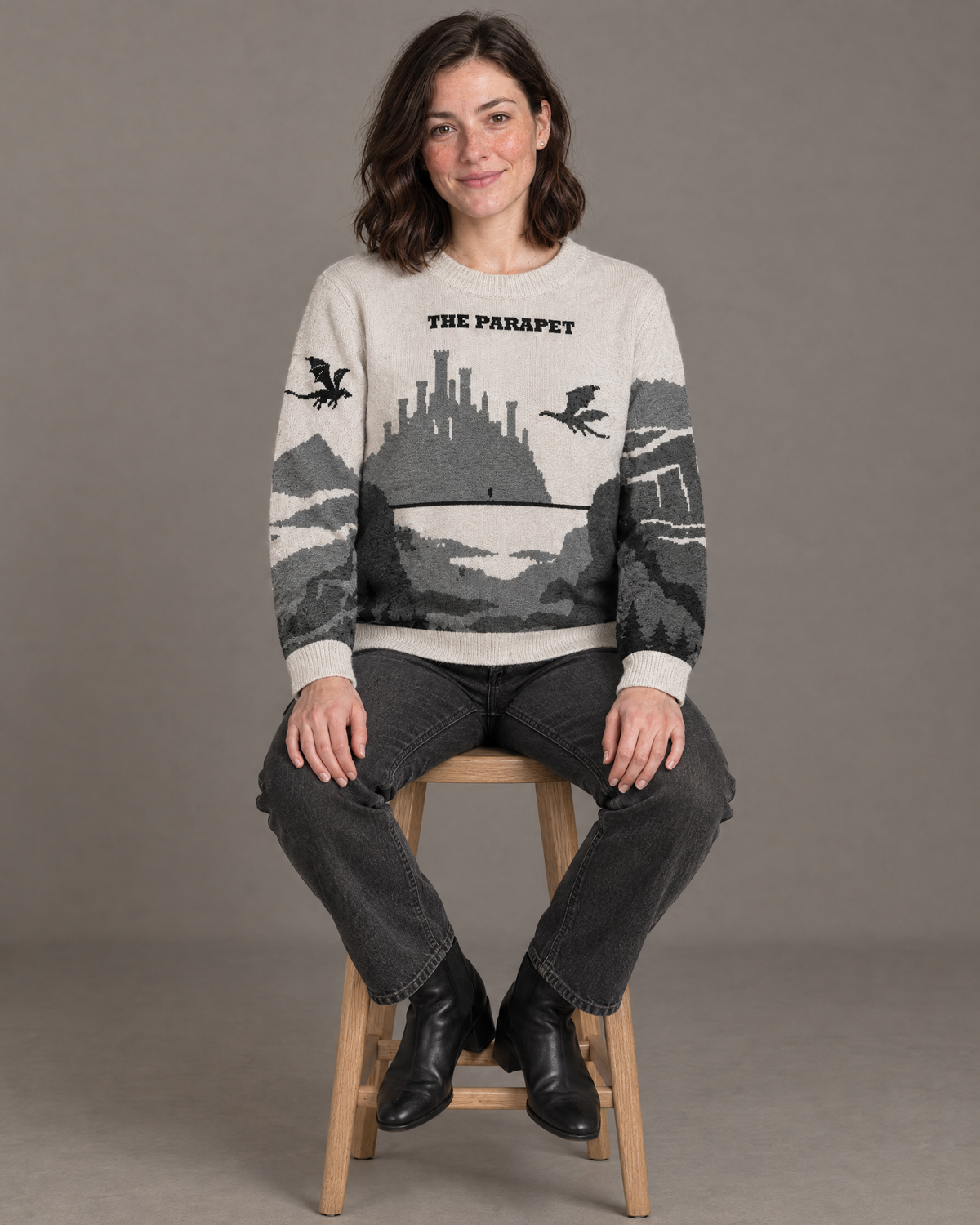 The Parapet knitted sweater, seated