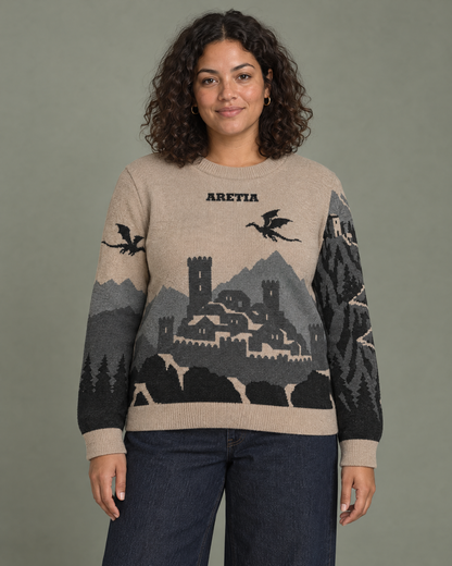 Aretia knitted sweater, front with walled mountain stronghold and dragon