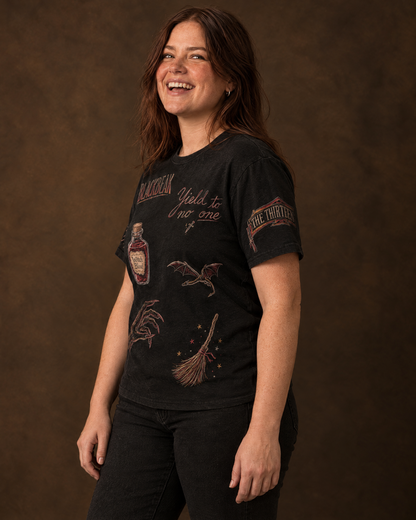 Manon and the Thirteen Doodles Tee, three-quarter view with sleeve