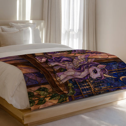 Pegasus Velveteen Plush Blanket on a bed