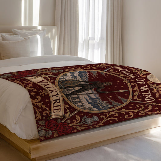 Valkyrie House of Wind Crest Velveteen Plush Blanket on a bed