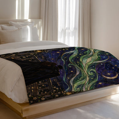 Starfall Stained Glass Velveteen Plush Blanket on a bed