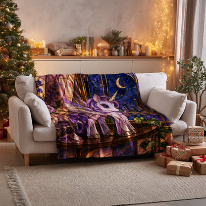 Pegasus Velveteen Plush Blanket on a sofa