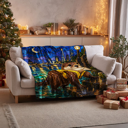 Otter Velveteen Plush Blanket on a sofa