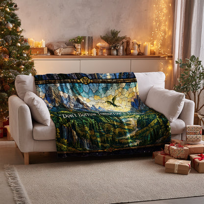 Empyrean Stained Glass Velveteen Plush Blanket on a sofa