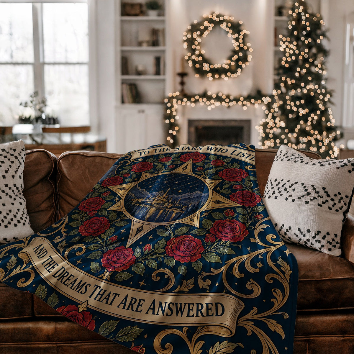 To The Stars Who Listen Rose Crest Velveteen Plush Blanket on a couch