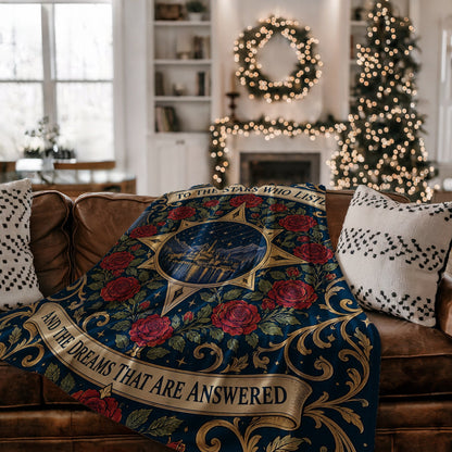 To The Stars Who Listen Rose Crest Velveteen Plush Blanket on a couch