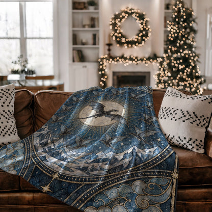 The Thirteen Stained Glass Velveteen Plush Blanket on a couch