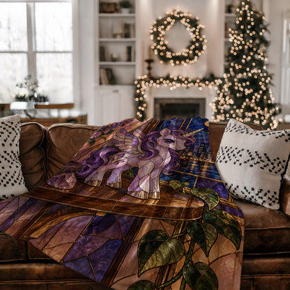 Pegasus Velveteen Plush Blanket on a couch