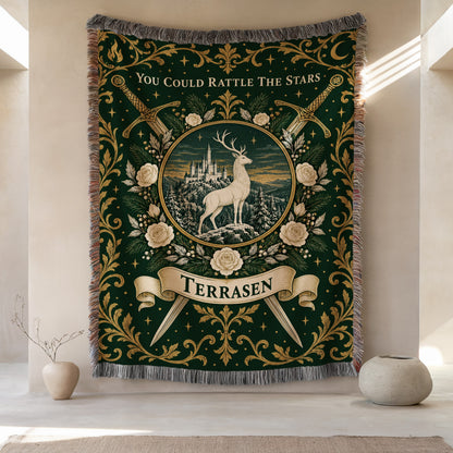 Terrasen Crest Woven Throw Blanket hanging on a wall